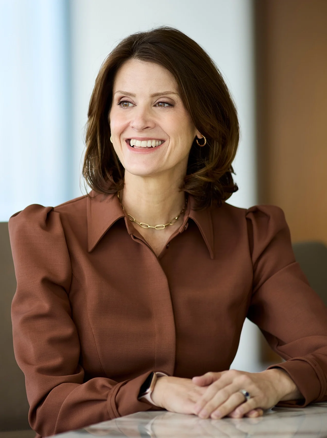 Anna Rotman smiling in conference room